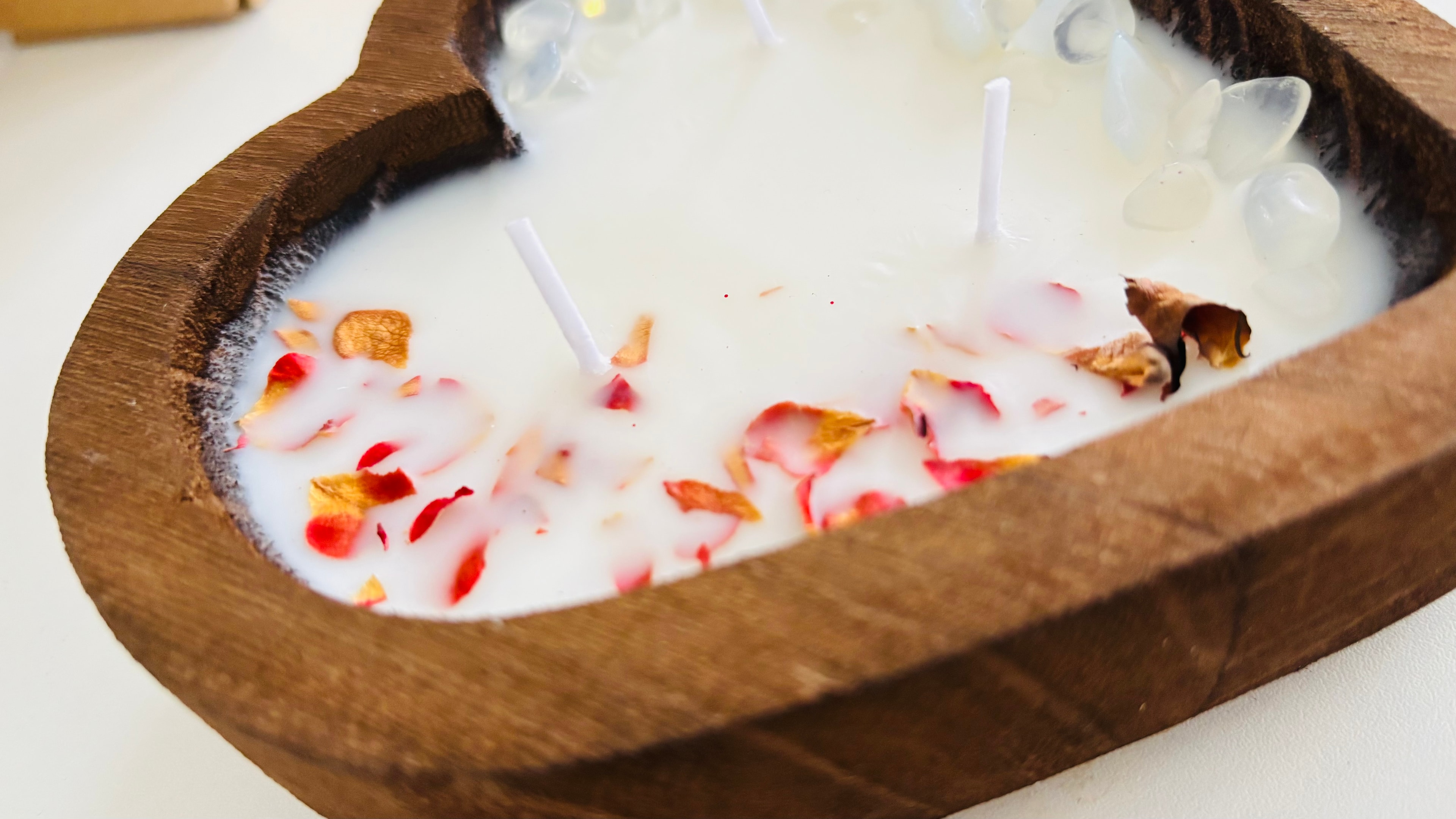 Rose quartz and dried rose petals in a Blessed Collection heart candle